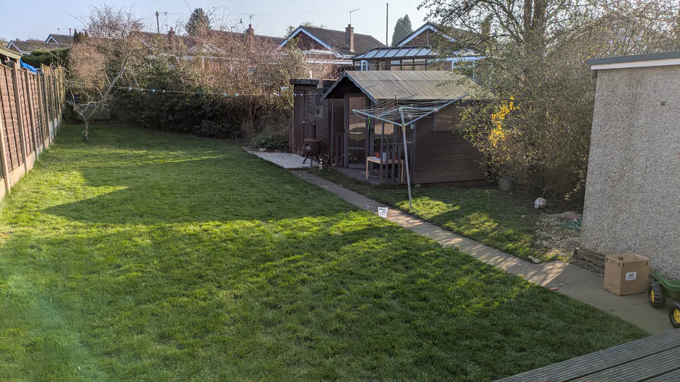 Back garden before the redesign, showing open lawn and an underused side path
